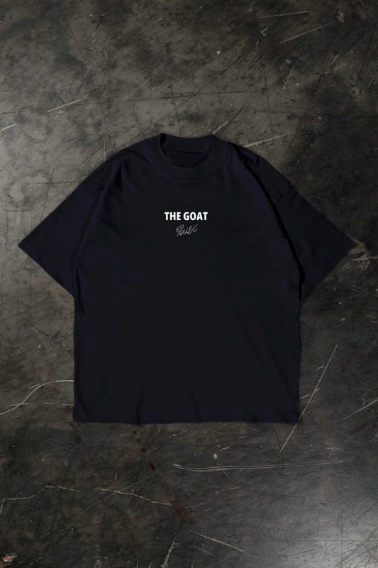 Black t-shirt with 'THE GOAT' text on a textured dark surface
