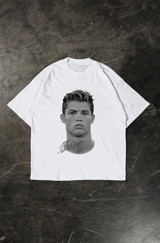 White t-shirt with a graphic of a Cristiano Ronaldo on a textured dark background
