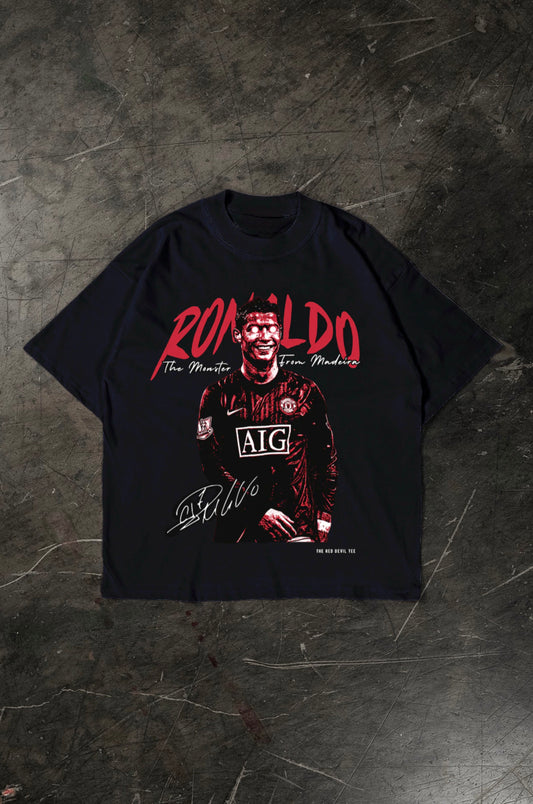 Black t-shirt with a graphic of a Cristiano Ronaldo in a sports jersey and 'Ronaldo' text on a dark textured background