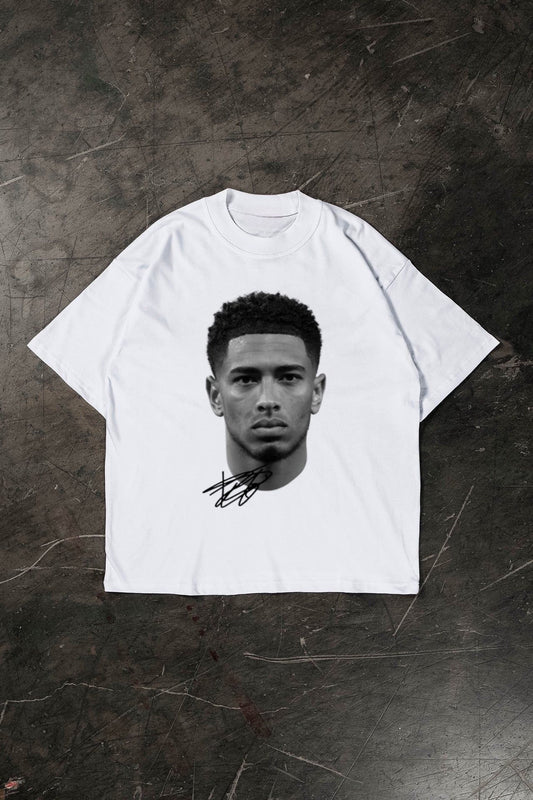 White t-shirt with a black and white graphic of Jude Bellingham on a textured dark surface