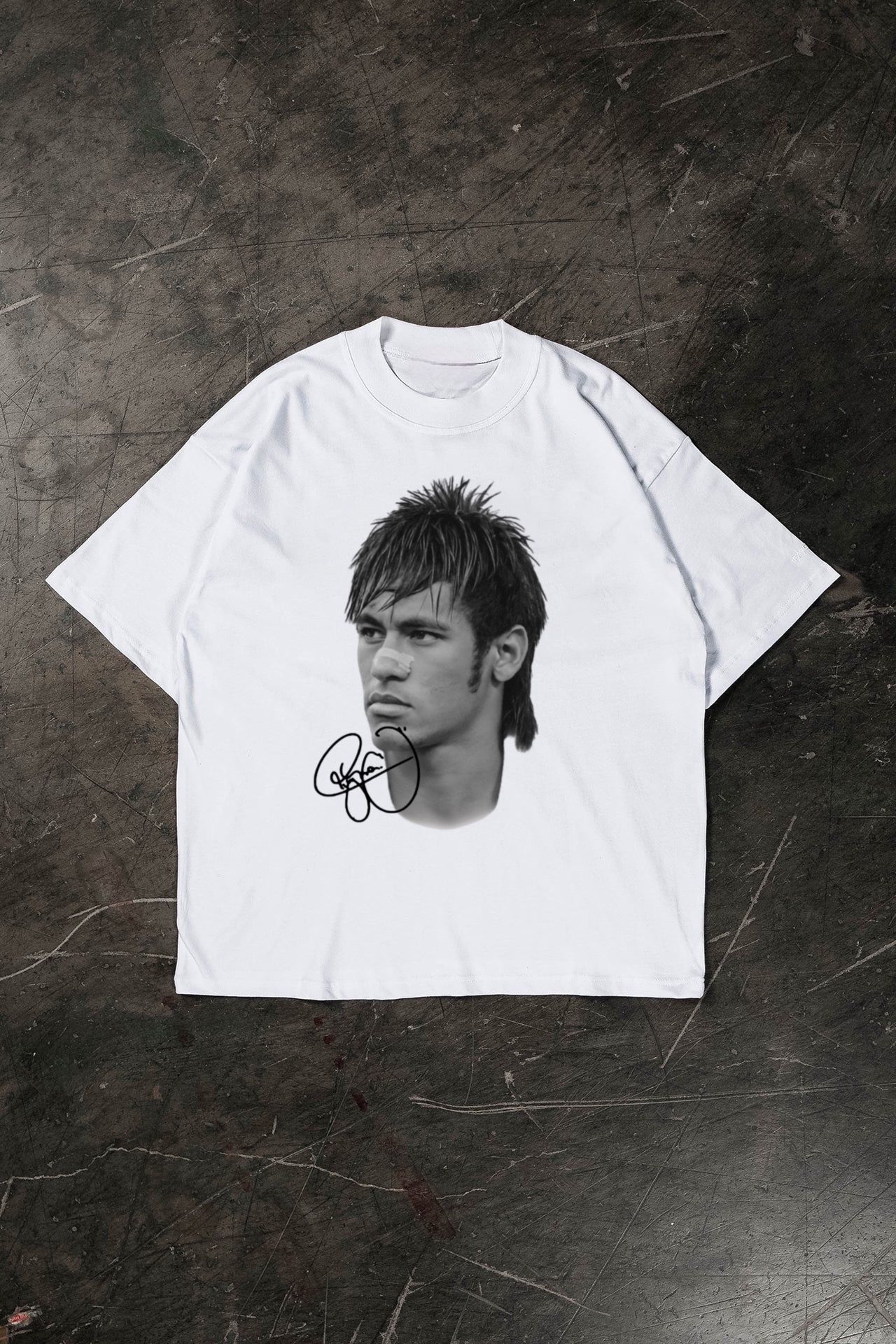 White t-shirt with a graphic of a Neymar Jr and signature on a dark textured surface